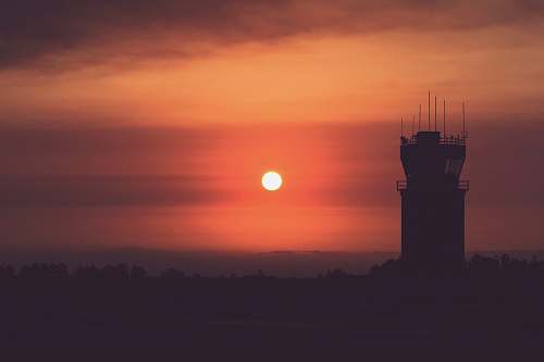 sky silhouette of tower during golden hours sun